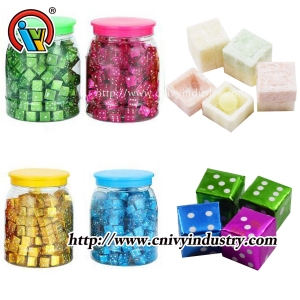 Dice chewing bubble gum with candy ball
