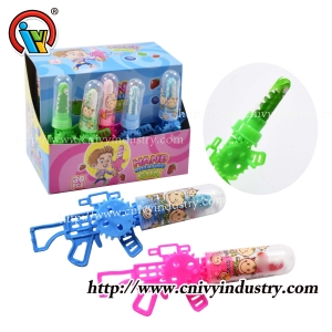 Gun shape hand shaking rotating toy lollipop candy
