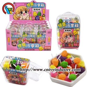 Gummy lollipop candy in luggage bottle